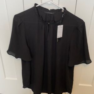 Tahari black blouse Large. NWT
